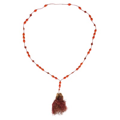 Lot 475 - A Chinese string of coral prayer beads.