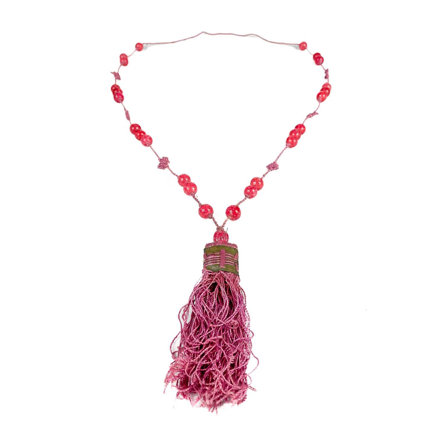 Lot 478 - A Chinese string of pink Peking glass beads.