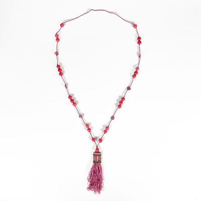 Lot 478 - A Chinese string of pink Peking glass beads.