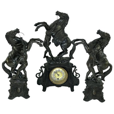 Lot 1719 - A Continental spelter clock garniture.