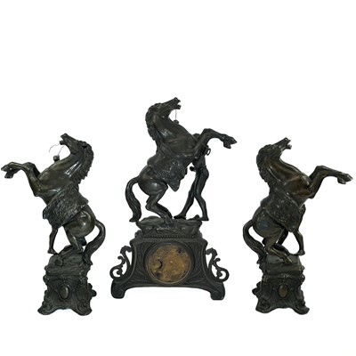 Lot 1719 - A Continental spelter clock garniture.