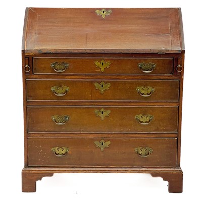 Lot 1834 - A small country made oak and mahogany bureau.