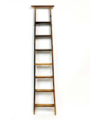 Lot 92 - An early 20th century pine library ladder.