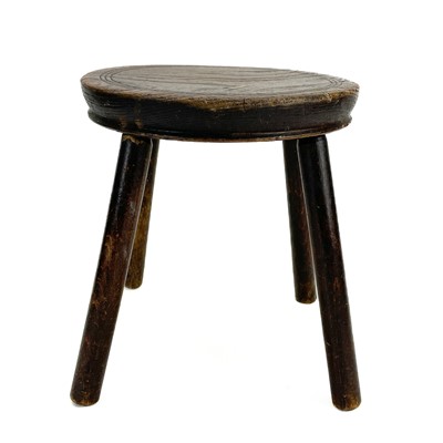 Lot 133 - An elm top small circular stool.