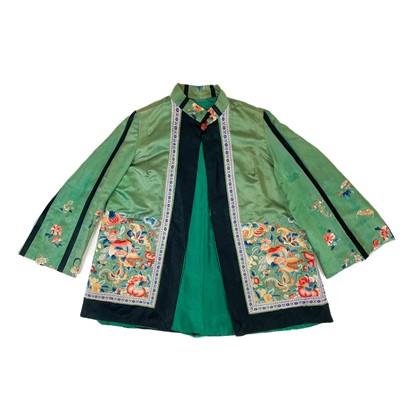 Lot 699 - A Chinese green silk embroidered jacket, late 19th century.