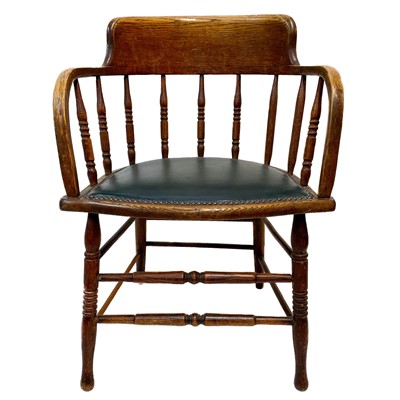 Lot 47 - An early 20th century oak bow smokers chair.