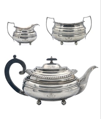 Lot 256 - A George V silver three piece tea set by William Hutton & Sons Ltd.