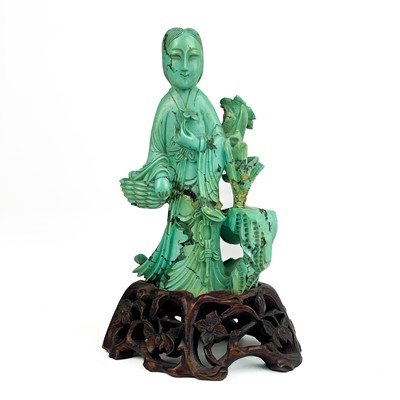 Lot 1283 - A Chinese carved turquoise figure of a lady, 19th century.