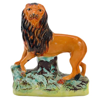 Lot 6 - A Victorian Staffordshire figure of a lion.