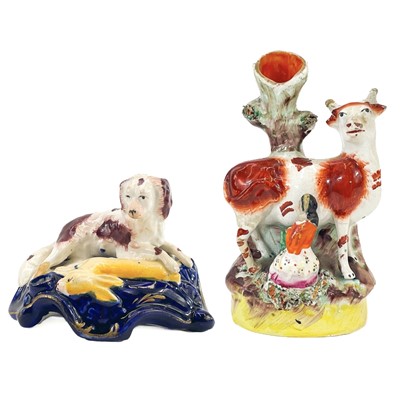 Lot 11 - A Victorian Staffordshire spaniel and hare quill holder.