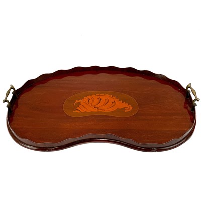 Lot 34 - An Edwardian mahogany and shell inlaid kidney shape tray.