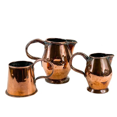 Lot 168 - A late George III copper ale jug.