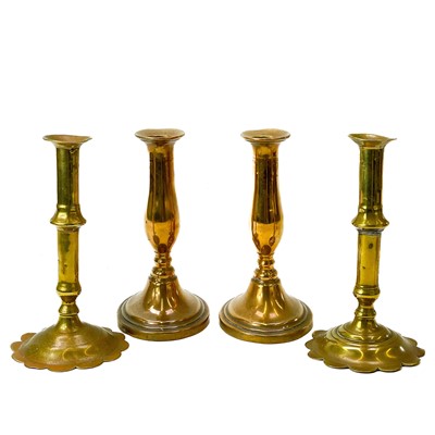 Lot 200 - Two similar early 18th century brass candlesticks.