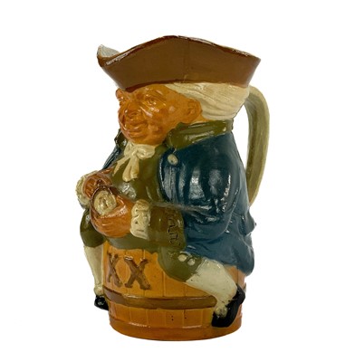 Lot 835 - A Royal Doulton Lambeth stoneware toby jug.