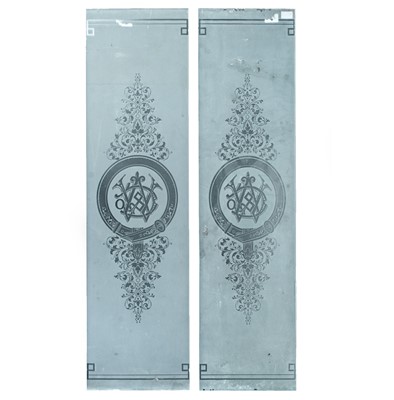 Lot 94 - A pair of acid-etched monogrammed glass panels.