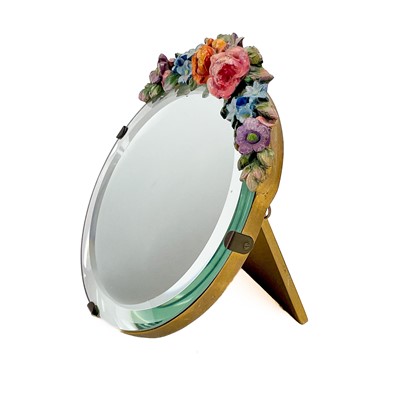 Lot 37 - A circular Barbola style easel mirror.