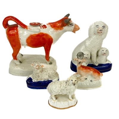 Lot 153 - A Staffordshire pottery cow creamer and cover.