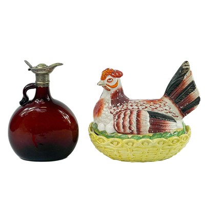 Lot 853 - A late Victorian Staffordshire pottery hen on nest egg crock.