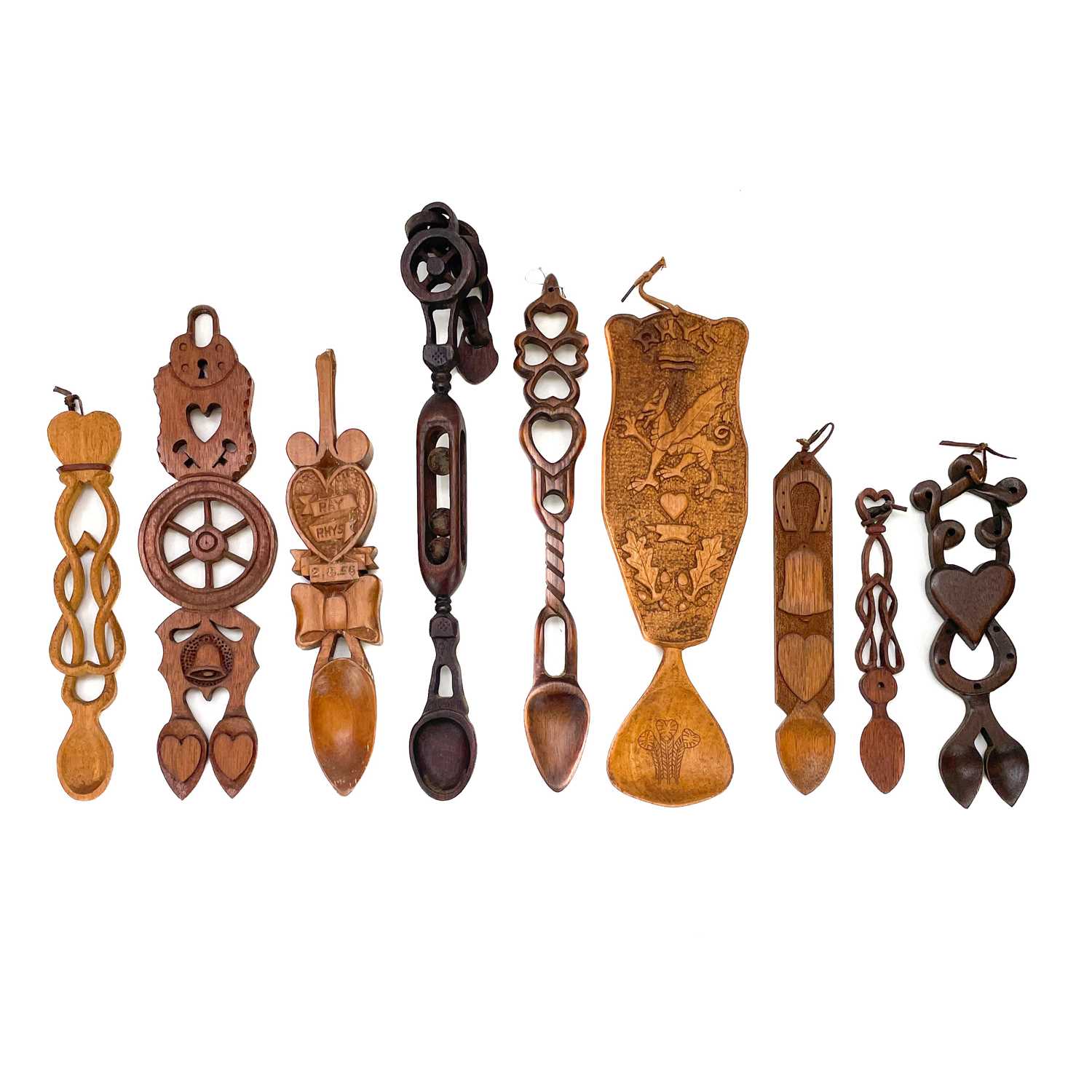 Lot 78 A collection of nine Welsh love spoons.