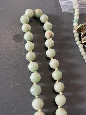 Lot 458 - A selection of green jade jewellery.