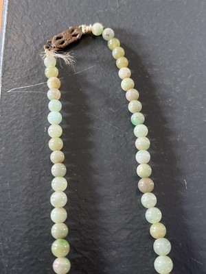 Lot 458 - A selection of green jade jewellery.