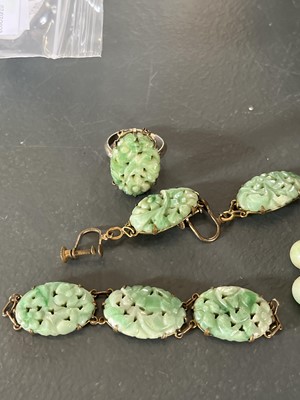 Lot 458 - A selection of green jade jewellery.