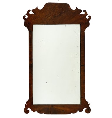 Lot 1867 - A walnut framed fretwork wall mirror.