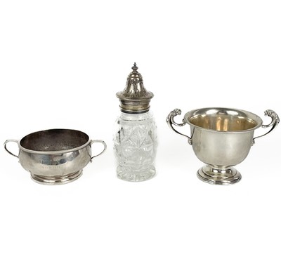 Lot 125 - A George V silver twin handled pedestal cup,  a twin handled bowl and a silver lid caster.