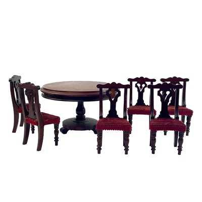 Lot 141 - A late Victorian miniature circular mahogany dining table and six chairs.