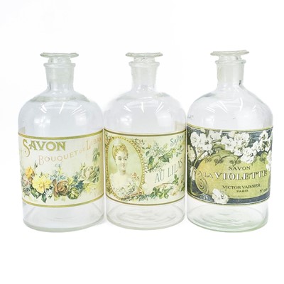 Lot 109 - Three large glass pharmacy advertisement bottles.