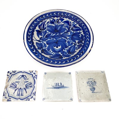 Lot 123 - A Delft blue and white tile, painted with a merchant in a boat.