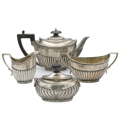 Lot 85 - A Victorian silver three piece bachelor tea set by James Deakin & Sons.