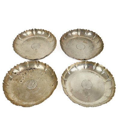 Lot 233 - A George V silver set of four coin set dishes by Charles Henry Townley & John William Thomas.