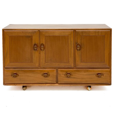 Lot 460 - An Ercol Windsor light elm sideboard.