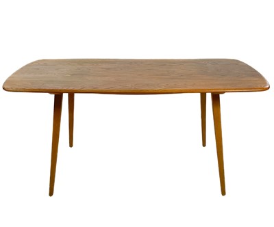 Lot 500 - An Ercol elm and beech 382 model oblong dining table.