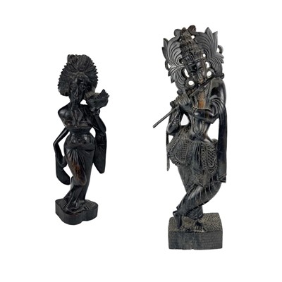 Lot 1434 - A large Burmese carved wood figure of a female flutist.