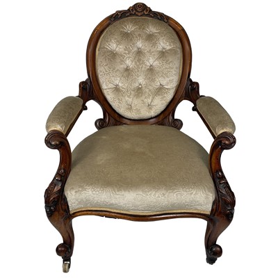 Lot 1852 - A Victorian walnut upholstered serpentine fronted open armchair.