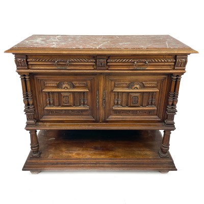 Lot 1856 - A late 19th century continental walnut marble top buffet.