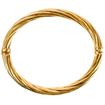 Lot 39 - A 9ct hallmarked gold hinged hollow bangle.