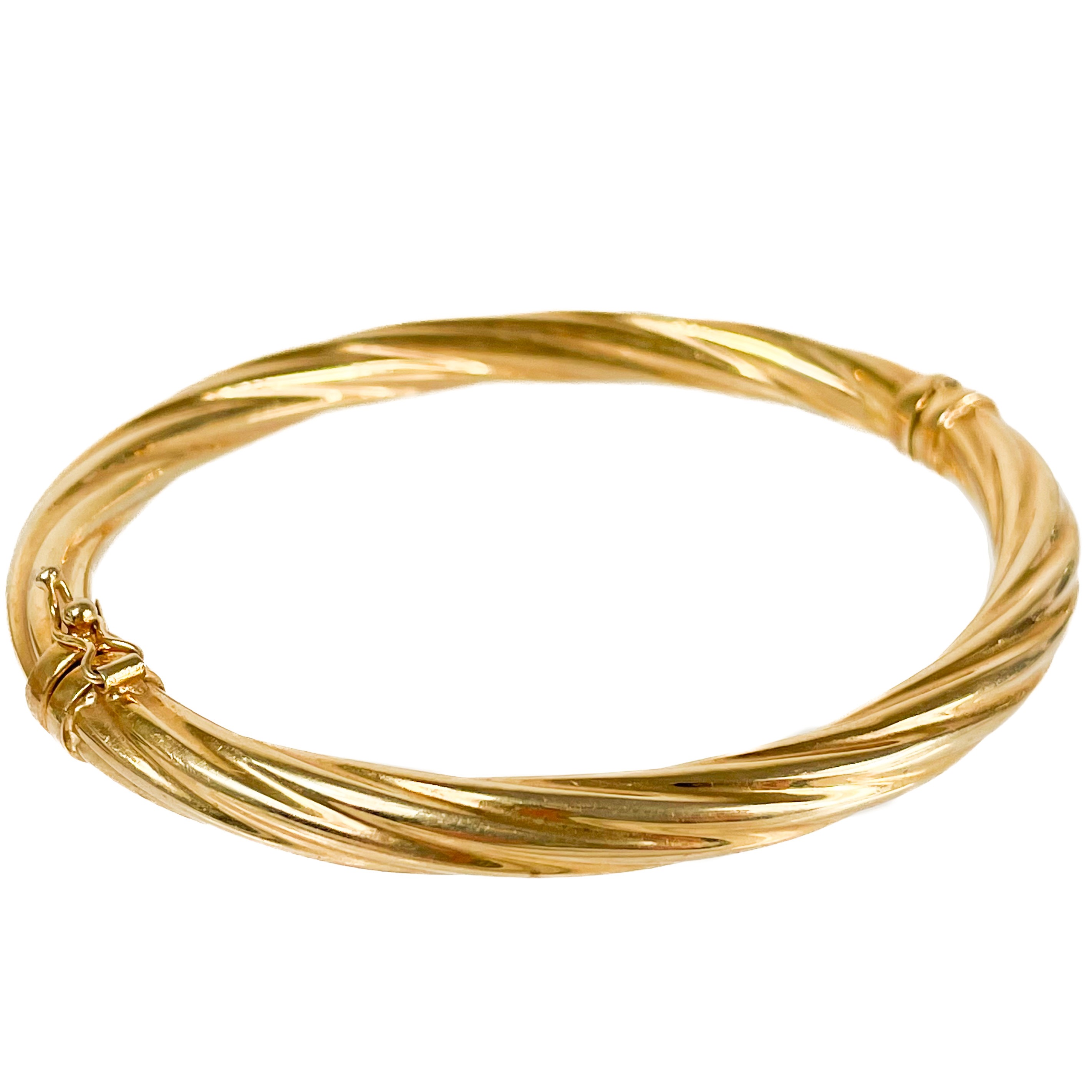 Lot 39 - A 9ct hallmarked gold hinged hollow bangle.