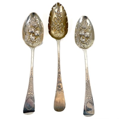 Lot 336 - Three George IV silver berry spoons.