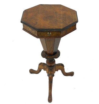 Lot 1837 - A Victorian walnut octagonal sewing table.