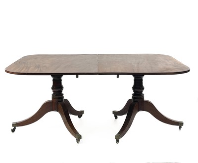 Lot 1886 - A Regency mahogany twin pillar dining table.