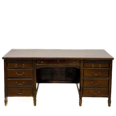 Lot 1887 - A 20th century oak fixed pedestal desk.