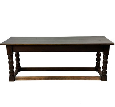 Lot 1944 - An oak refectory dining table.