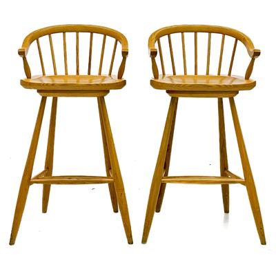 Lot 1830 - A pair of beech high stools with horseshoe backs.