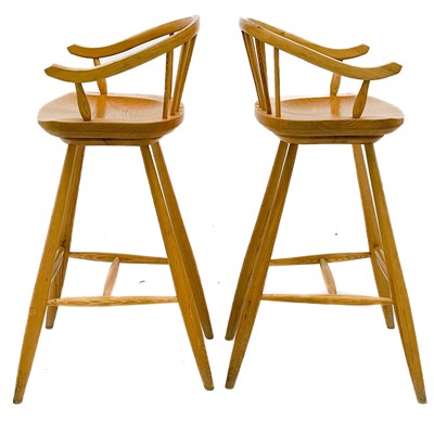 Lot 1830 - A pair of beech high stools with horseshoe backs.