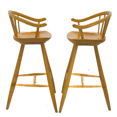 Lot 1830 - A pair of beech high stools with horseshoe backs.