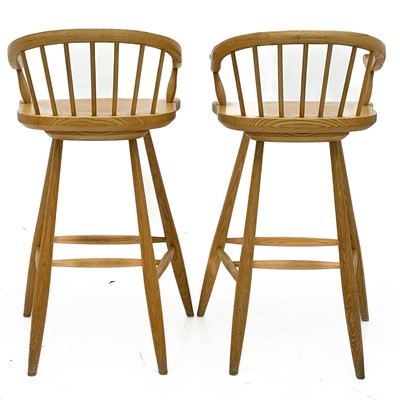 Lot 1830 - A pair of beech high stools with horseshoe backs.