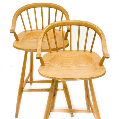Lot 1830 - A pair of beech high stools with horseshoe backs.